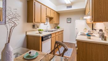 Cantera spacious kitchen with sink, stove, fridge, and plenty of cabinetry